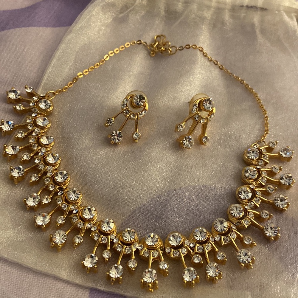 crystal necklace and earrings with gold tone setting